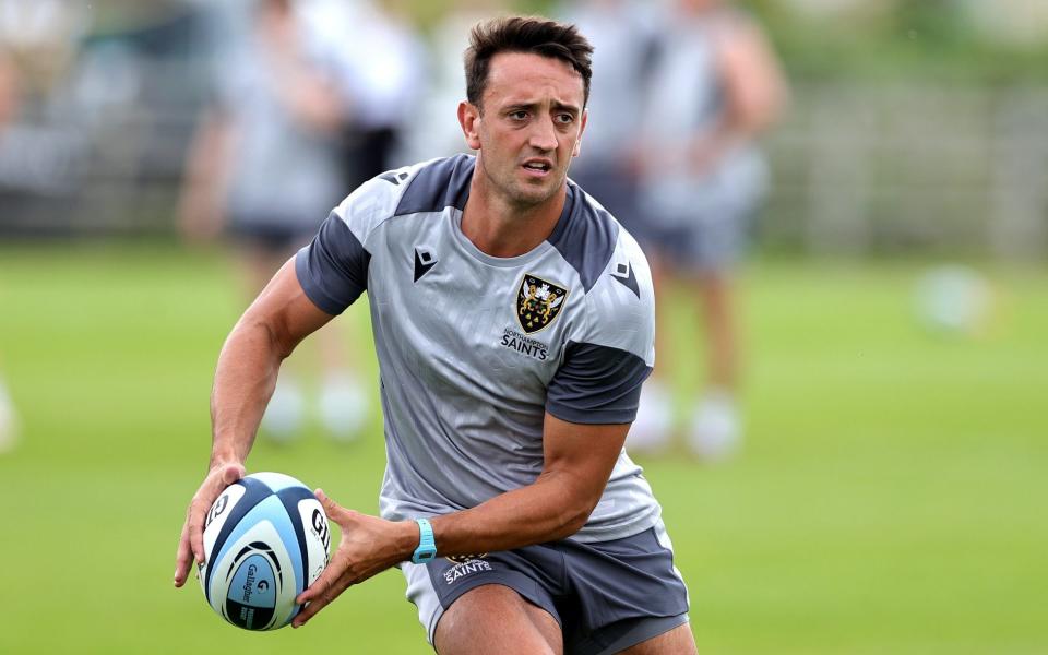 Alex Mitchell passes the ball in Saints training