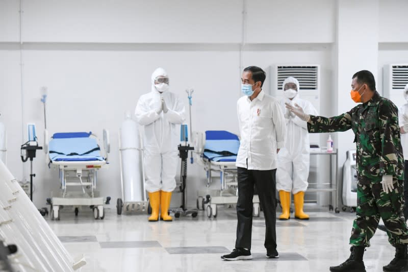 Indonesia's President Joko Widodo takes a look at the emergency hospital handling of COVID-19 in Kemayoran Athletes Village in Jakarta