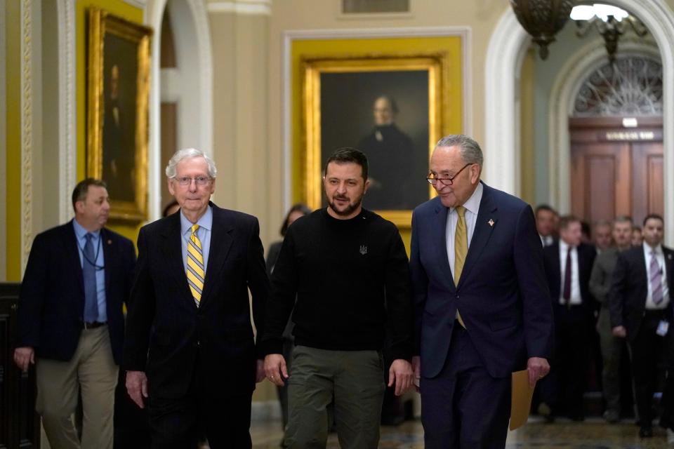 Ukrainian President Volodymyr Zelenskyy arrives for a meeting at the U.S. Capitol with Senate Minority Leader Mitch McConnell, R-Ky., left, and Senate Majority Leader Chuck Schumer, D-N.Y., on Dec. 12, 2023 in Washington.