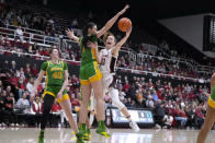 Stanford guard Elena Bosgana (20) is fouled by Oregon forward Kennedy Basham (1) during the first half of an NCAA college basketball game Friday, Jan. 19, 2024, in Stanford, Calif. (AP Photo/Tony Avelar)