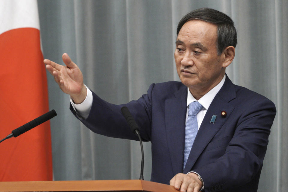 FILE - In this Sept. 11, 2019, file photo, Chief Cabinet Secretary Yoshihide Suga speaks during a press conference at the prime minister's official residence in Tokyo. Japan’s top government spokesman Suga, a longtime right-hand man for the outgoing Prime Minister Shinzo Abe, has emerged as a top successor candidate Tuesday, Sept. 1, as party executives met to decide logistics of a party presidential election expected in mid-September. (AP Photo/Eugene Hoshiko, File)