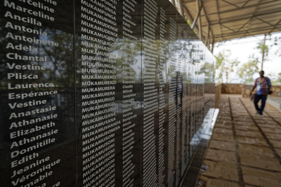 FILE - In this Friday, April 5, 2019 file photo, the names of those who were slaughtered as they sought refuge in the church, many with the same surname indicating a family, are written on a memorial to the thousands who were killed in and around the Catholic church during the 1994 genocide, outside the church in Ntarama, Rwanda. France's role before and during 1994's Rwandan genocide was a "monumental failure" that the country must face, the lead author of a sweeping report commissioned by President Emmanuel Macron said, as the country is about to open its archives from this period for the first time to the broader public. (AP Photo/Ben Curtis, File)