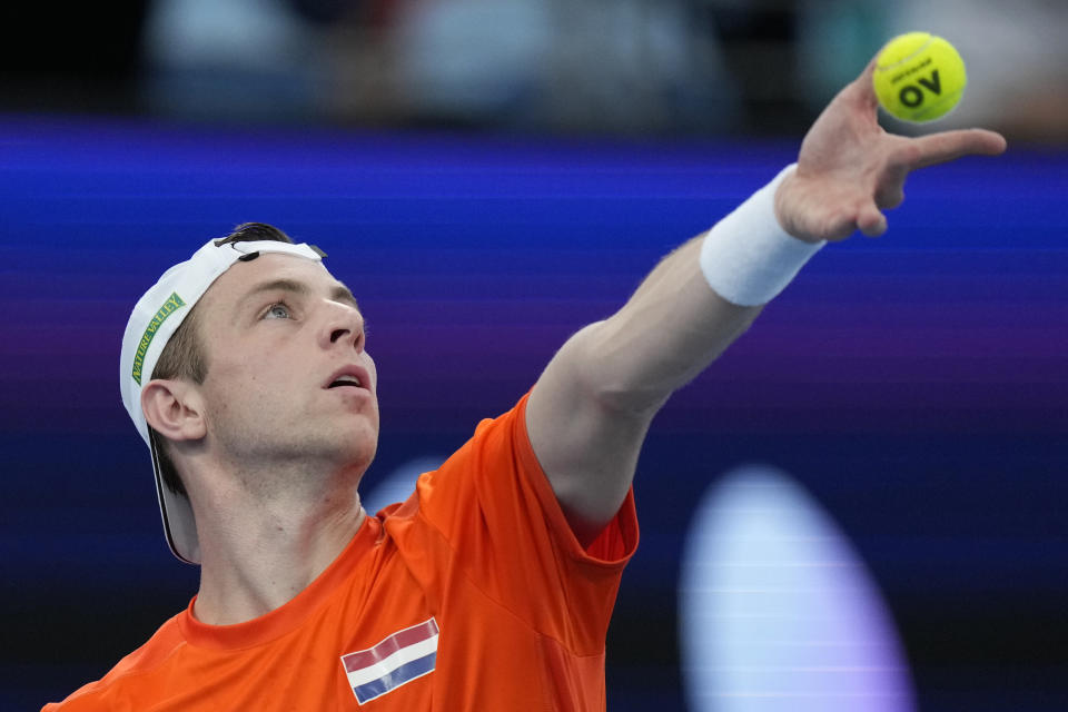 Tallon Griekspoor of Netherlands prepares to serve to Casper Ruud of Norway during the United Cup tennis tournament in Sydney, Saturday, Dec. 30, 2023. (AP Photo/Rick Rycroft)