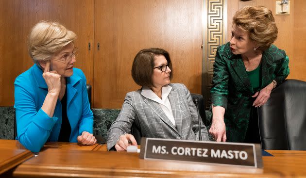 From left, Sen. Elizabeth Warren (D-Mass.), Sen. Catherine Cortez Masto (D-Nev.), and Sen. Debbie Stabenow (D-Mich.), talk before the start of a Senate Finance Committee hearing to examine President Joe Biden's proposed budget request for fiscal year 2023, on June 7, 2022. (Photo: via Associated Press)