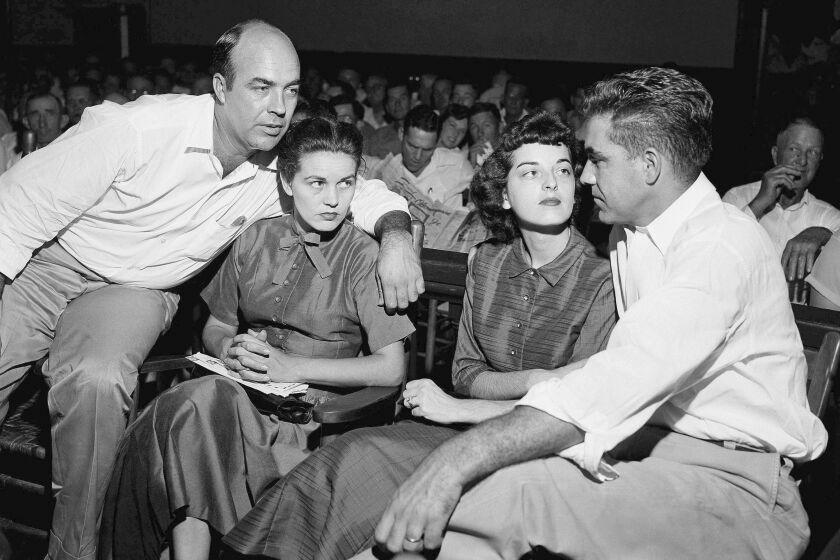 J.W. Milam, left, his wife, second from left, Roy Bryant, far right, and his wife, Carolyn Bryant.