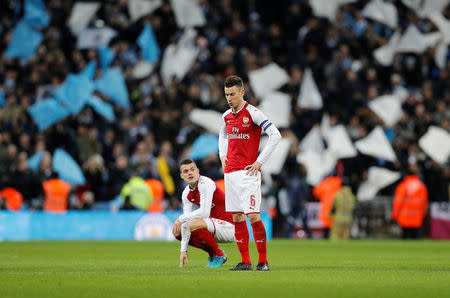 Soccer Football - Carabao Cup Final - Arsenal vs Manchester City - Wembley Stadium, London, Britain - February 25, 2018 Arsenal's Granit Xhaka and Laurent Koscielny look dejected after the match REUTERS/Darren Staples