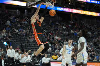 Oregon State forward Tyler Bilodeau (34) dunks against UCLA during the second half of an NCAA college basketball game in the first round of the Pac-12 tournament Wednesday, March 13, 2024, in Las Vegas. (AP Photo/John Locher)