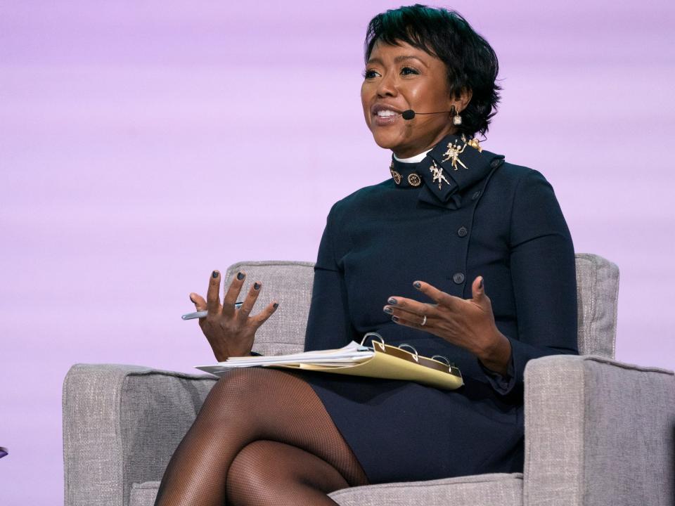 Mellody Hobson gestures while sitting onstage