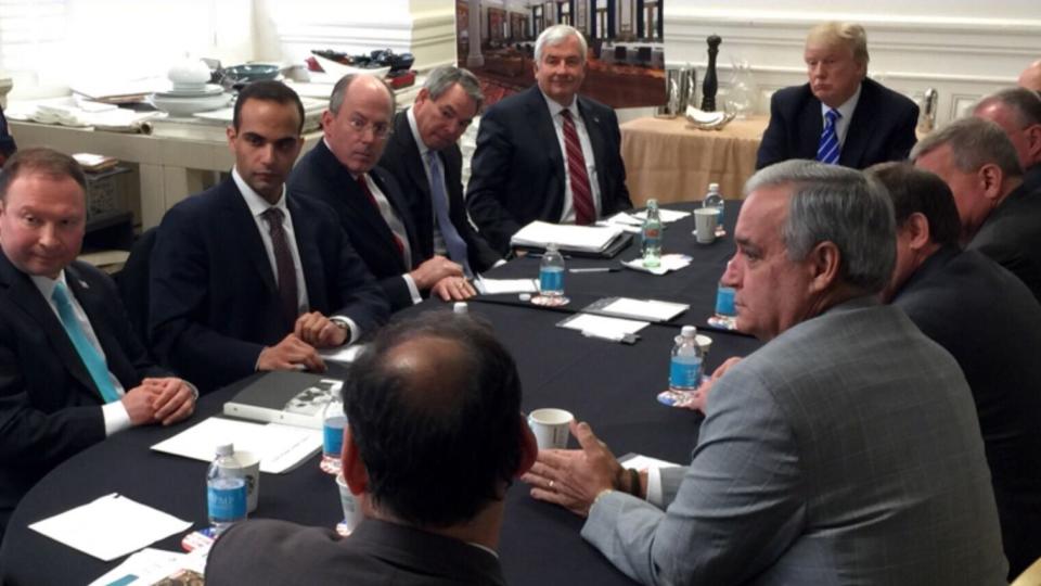 In this photo from President Donald Trump's Twitter account, George Papadopoulos, third from left, sits at a table with then-candidate Trump and others at what is labeled at a national security meeting in Washington that was posted on March 31, 2016. (Donald Trump's Twitter account via AP)