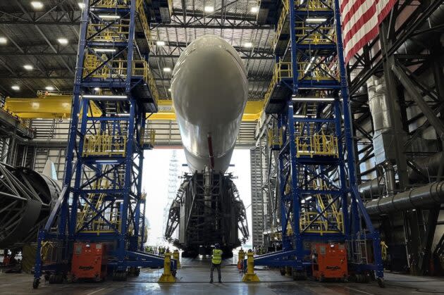 Blue Origin’s New Glenn rocket is rolled out from the company’s Florida factory for tests. (Blue Origin Photo)