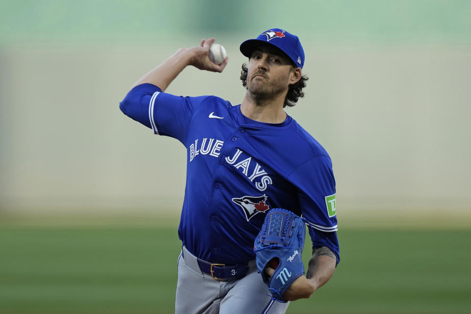 Toronto Blue Jays starting pitcher Kevin Gausman throws during the first inning of a baseball game against the Kansas City Royals Tuesday, April 23, 2024, in Kansas City, Mo. (AP Photo/Charlie Riedel)