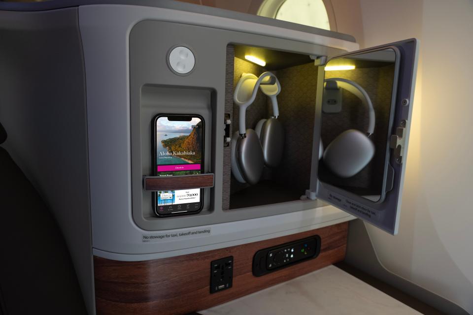 Headphones and an 18-inch screen in an Hawaiian Airlines' business class seat.