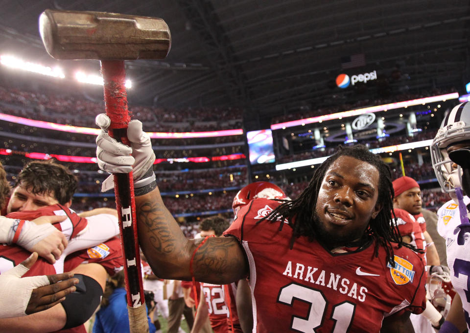 Jan 6, 2012; Dallas, TX, USA; Arkansas Razorbacks linebacker Jerico Nelson (31) raise a sledgehammer after a 29-16 victory in the Cotton Bowl against the Kansas State Wildcats at the Cowboys Stadium. Mandatory Credit: Matthew Emmons-USA TODAY Sports