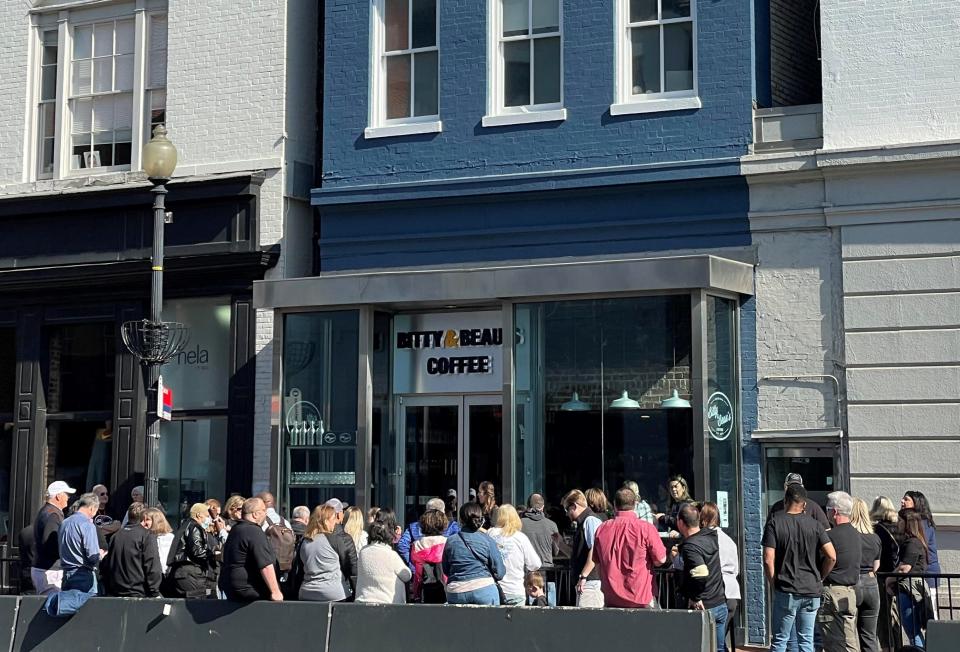 Customers line up outside the newest Bitty & Beau’s Coffee location in Washington, D.C., on its opening day, April 30, 2022.