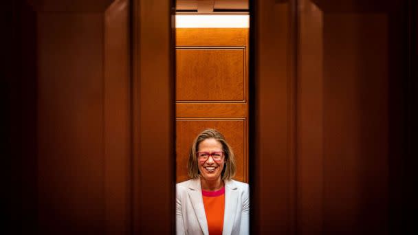 PHOTO: FILE - Sen. Kyrsten Sinema smiles while talking to reporters after leaving the Senate chamber on Capitol Hill, Nov. 16, 2022 in Washington, DC. (Kent Nishimura/Los Angeles Times via Getty Images, FILE)