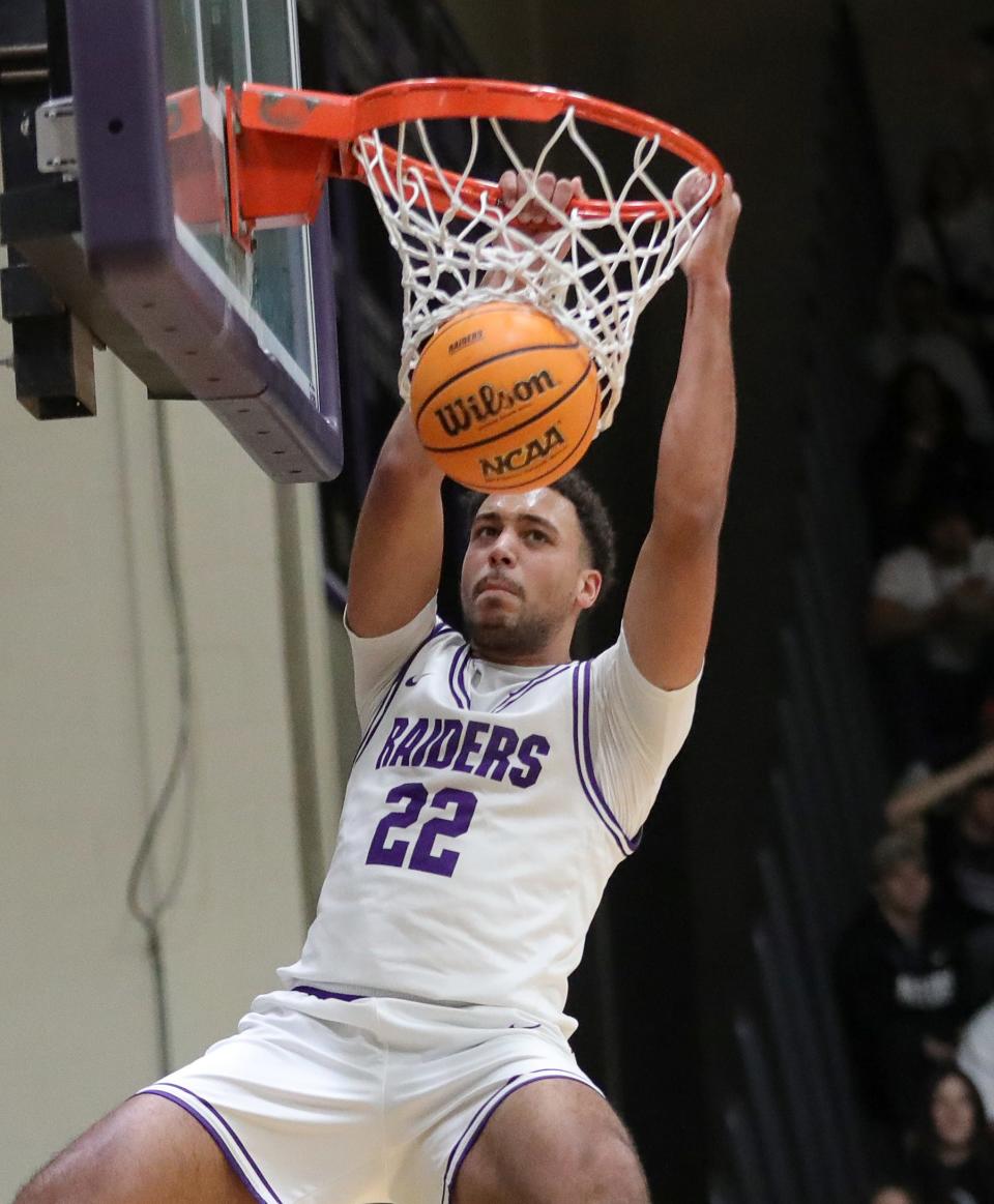 Mount Union's Christian Parker dunks during an Ohio Athletic Conference Tournament semifinal game against Heidelberg this season.