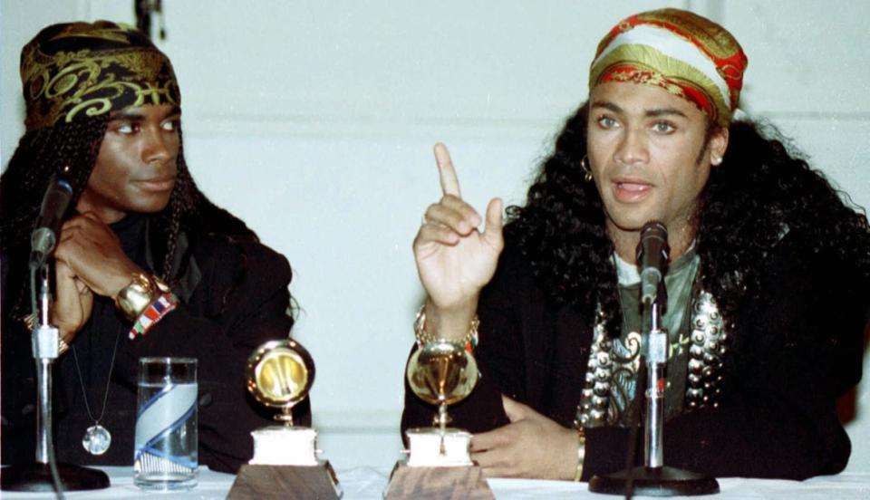 (Left to right) Fabrice Morvan and Rob Pilatus of Milli Vanilli talk to the media during a news conference in this Nov. 21, 1990, photo in Hollywood. (AP Photo/Nick Ut)