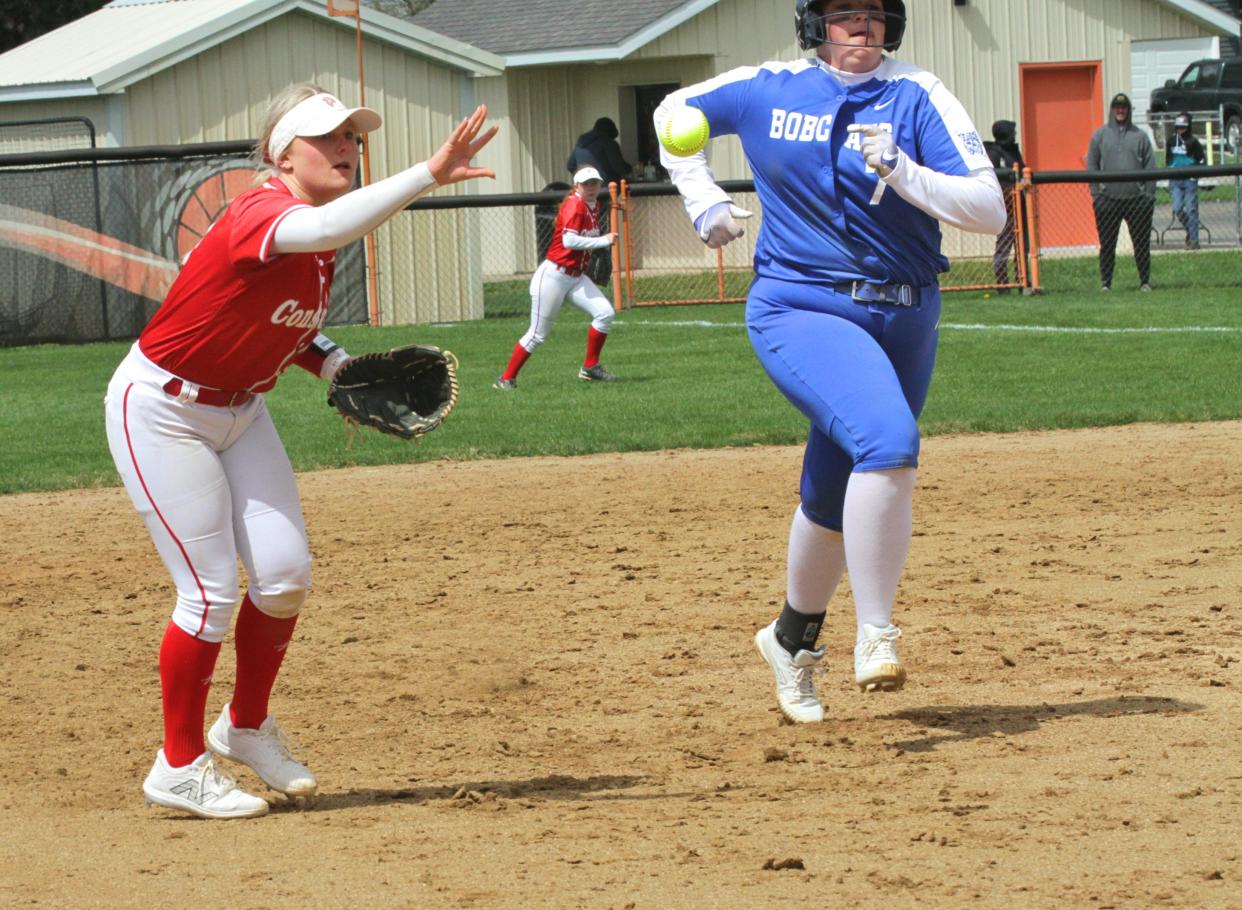 Constantine shortstop Olivia Ransbottom flips over to third base to cut down Brooklynn Root advancing on Saturday.