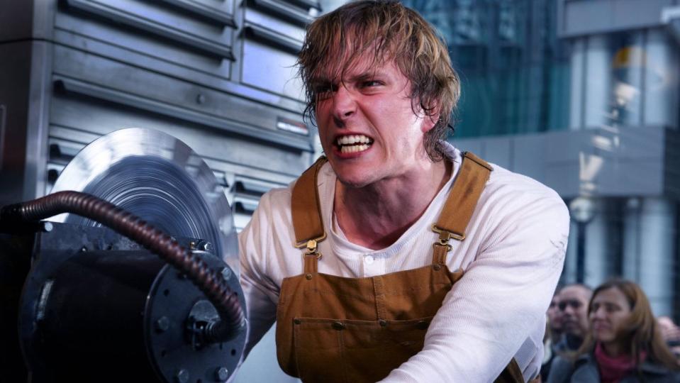 a man faces down a spinning saw blade in a scene from saw 3d