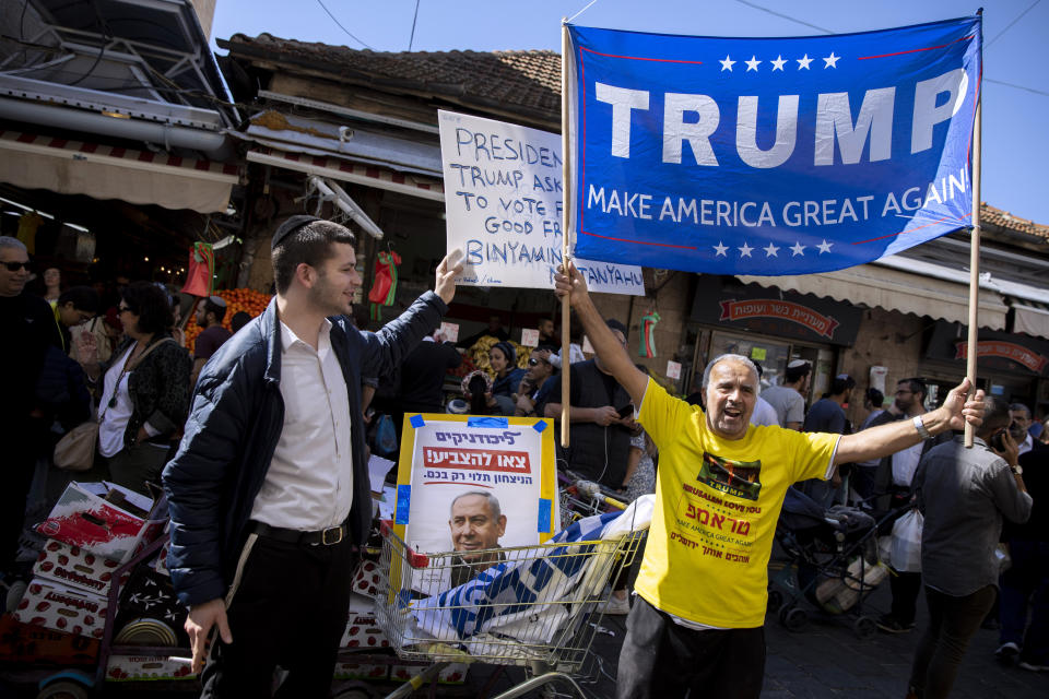 Supporters of Israeli Prime Minister and head of the Likud party Benjamin Netanyahu, shout slogans following Netanyahu's election campaign rally at a market in Jerusalem, Friday, Feb. 28, 2020. (AP Photo/Oded Balilty)