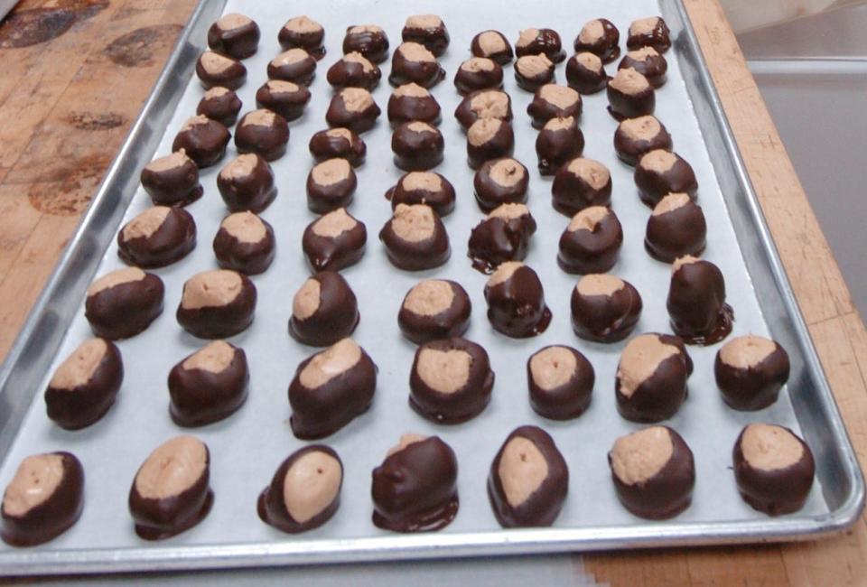 Buckeyes are chocolate-covered peanut butter balls, named after Ohio's state tree.