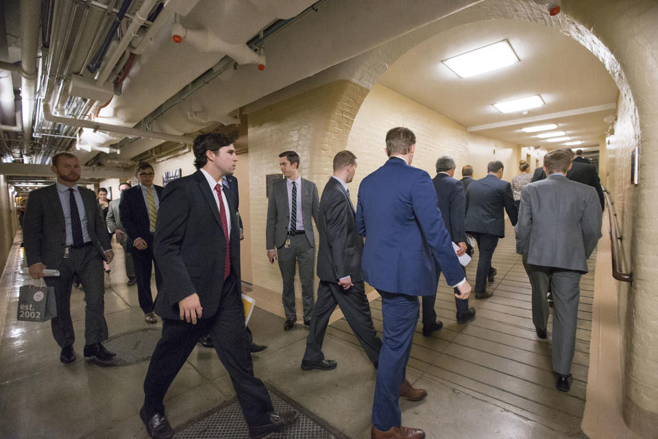 Members of Congress and their aides walk through a basement tunnel on Capitol Hill in 2015.