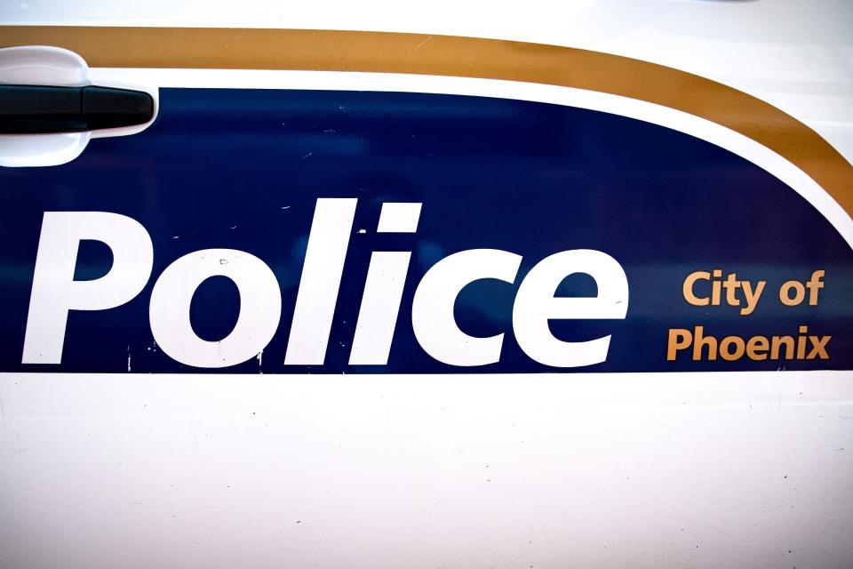 The side of a Phoenix police vehicle.