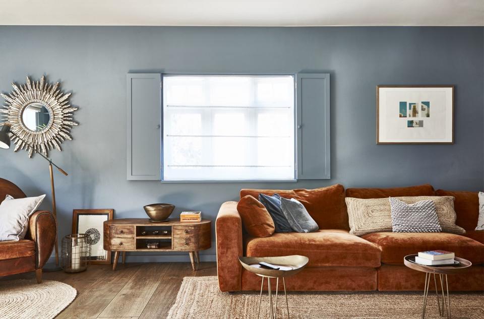 a living room with a couch and a small tables