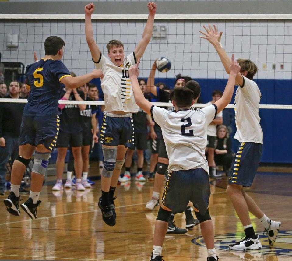 Spencerport's Brody Jackson (10) leaps with teammates as they celebrate Jackson's spike at the net for the final point in the fourth set giving them the victory over Brockport during their Class B boys volleyball championship finals Thursday, Nov. 10, 2022 at Victor High School.  Spencerport won the finals 3-1.