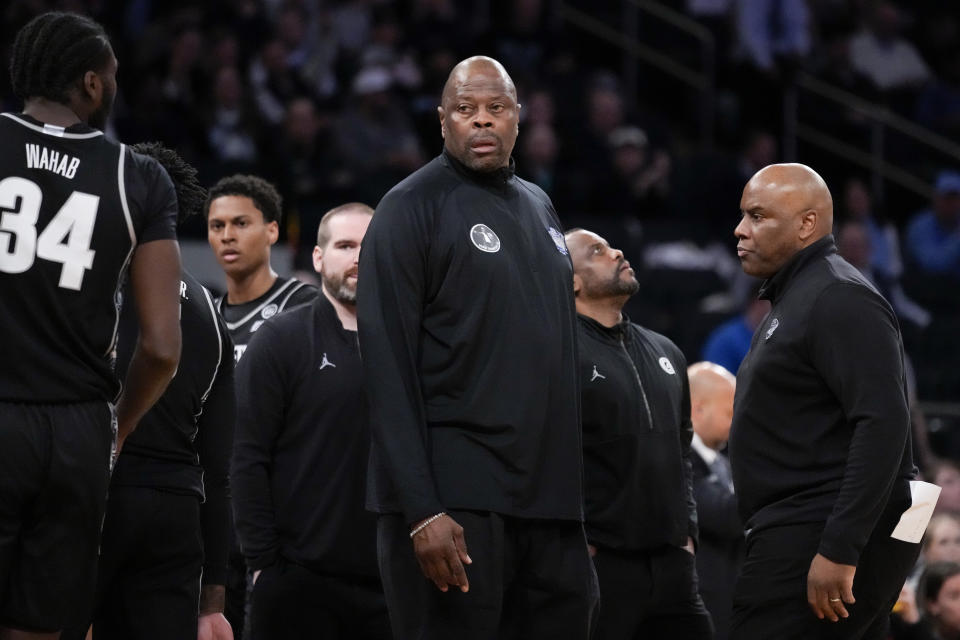 Georgetown Hoyas head coach Patrick Ewing stands on the court during a timeout in the first half of an NCAA college basketball game against Villanova during the first round of the Big East conference tournament, Wednesday, March 8, 2023, in New York. (AP Photo/John Minchillo)