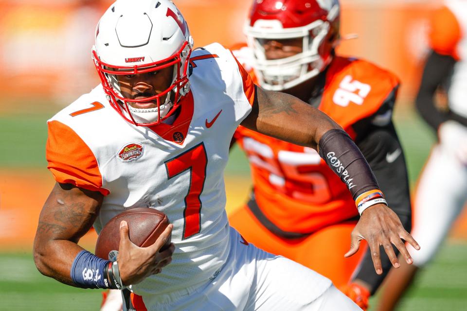 American squad quarterback Malik Willis of Liberty runs against the National squad during the Senior bowl at Hancock Whitney Stadium in Mobile, Ala. on Feb. 5, 2022.