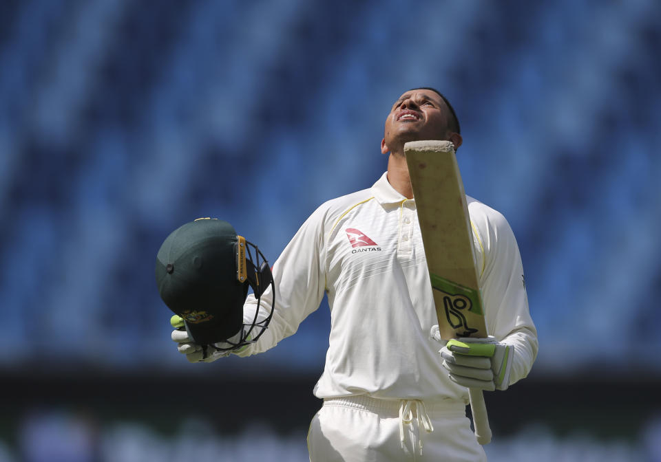 Australia's Usman Khawaja celebrates his centuray during their test match against Pakistan in Dubai, United Arab Emirates, Thursday, Oct. 11, 2018. (AP Photo/Kamran Jebreili)