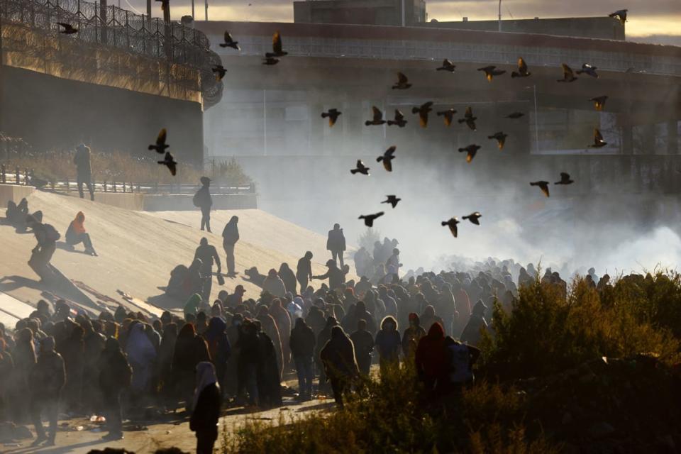 <div class="inline-image__caption"><p>Migrants queue near the border wall after crossing the Rio Bravo river to turn themselves in to U.S. Border Patrol agents to request asylum in El Paso, Texas on Dec. 13, 2022.</p></div> <div class="inline-image__credit">Jose Luis Gonzalez/Reuters</div>