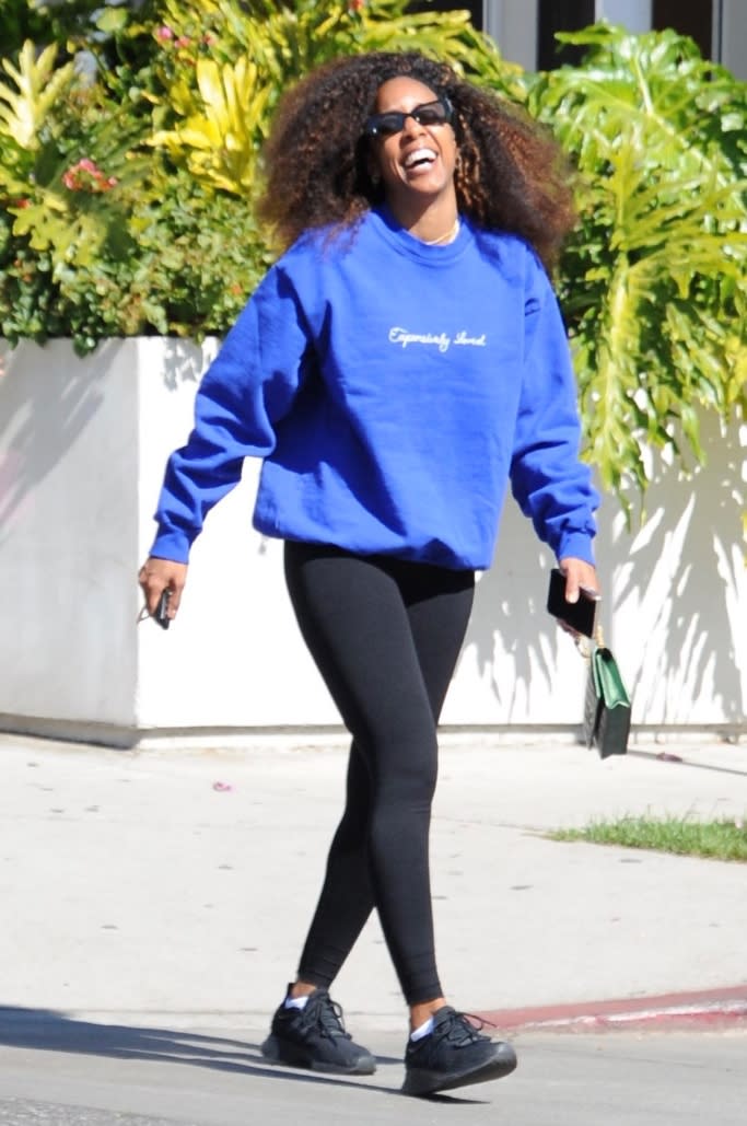 Kelly Rowland is seen laughing with a friend while out in West Hollywood on Friday, Feb. 25, 2022. - Credit: Splash