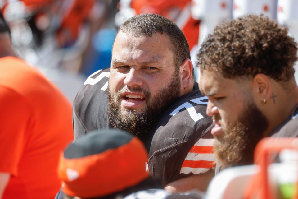 Cleveland Browns guard Joel Bitonio (75) sits on the bench during a game against the Baltimore Ravens on Oct. 1, 2022, in Cleveland.