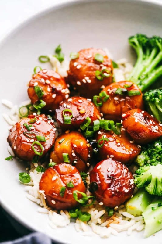 <p>The Recipe Critic</p><p>Honey garlic butter scallops get pan-seared and then coated in the most amazing honey garlic butter sauce. This meal is so quick and easy that you will make it again and again!</p><p><strong>Get the recipe: <a href="https://therecipecritic.com/scallops-recipe/" rel="nofollow noopener" target="_blank" data-ylk="slk:Honey Garlic Butter Scallops;elm:context_link;itc:0;sec:content-canvas" class="link rapid-noclick-resp">Honey Garlic Butter Scallops</a></strong></p>