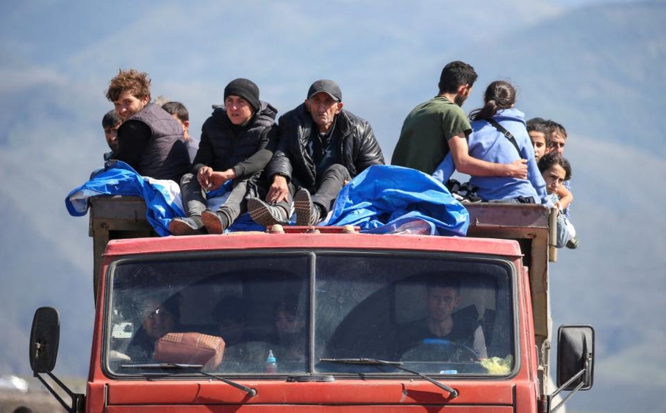 Refugees from Nagorno-Karabakh upon their arrival at the border village of Kornidzor, Armenia, in September 2023 (REUTERS)