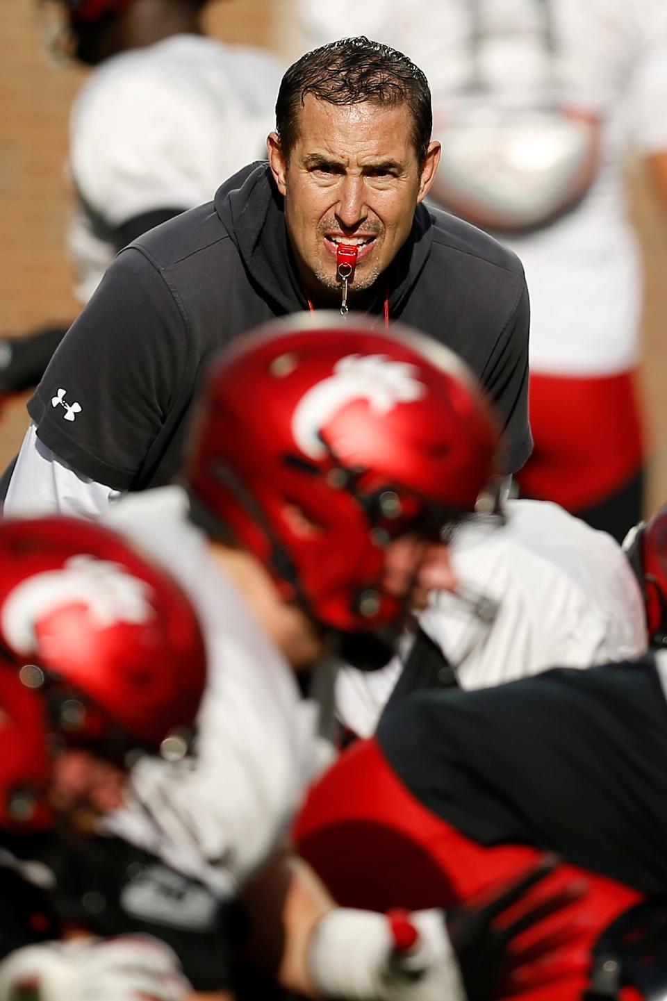 Cincinnati Bearcats head coach Luke Fickell looks over a play during a spring practice at Nippert Stadium in Cincinnati on Thursday, March 24, 2022.