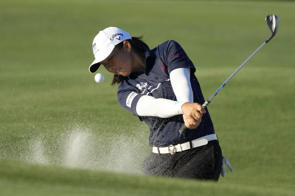 Ruoning Yin, of China, hits from a bunker onto the 17th green during the second round of the LPGA CME Group Tour Championship golf tournament, Friday, Nov. 17, 2023, in Naples, Fla. (AP Photo/Lynne Sladky)