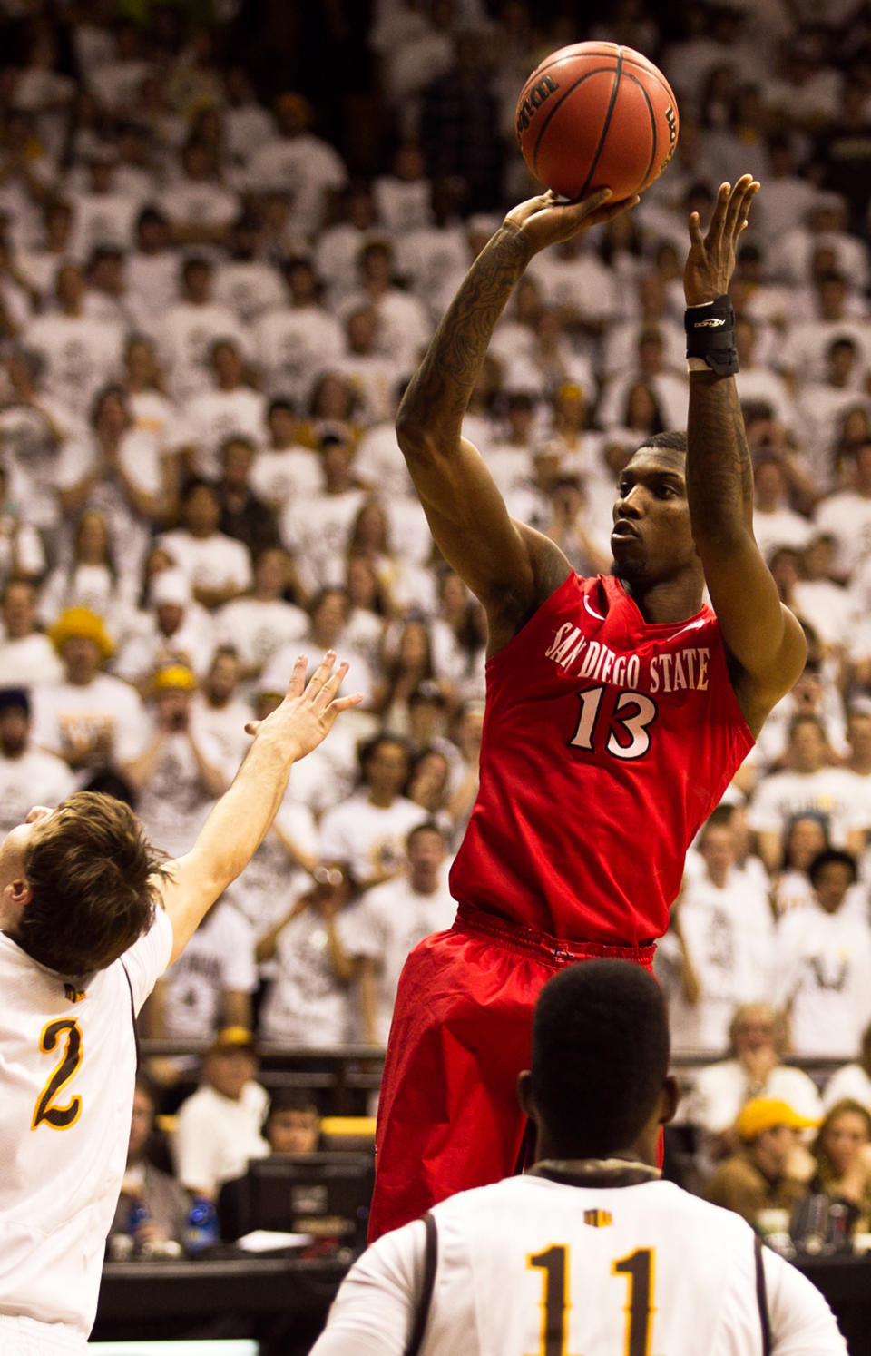 San Diego State forward Winston Shepard (13) pulls up for a jump shot during the first half against the University of Wyoming Cowboys in a NCAA college basketball game Tuesday, Feb. 11, 2014 at the Arena-Auditorium in Laramie, Wyo. (AP Photo/Jeremy Martin)