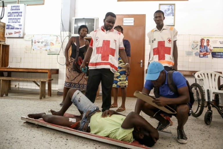 A man awaits treatment at the Secondary Hospital in Lome's Be district after he was shot in the leg when police and troops cracked down on a protest this week