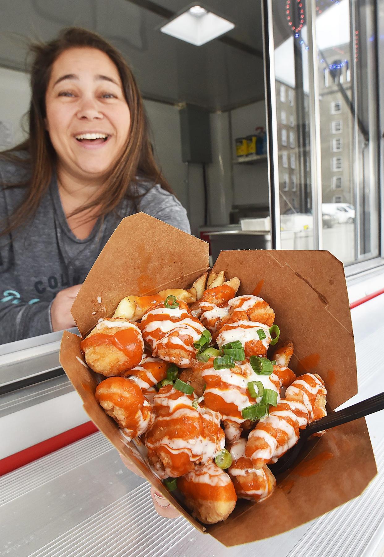 Owner Shelley Ring with Buffalo chicken Poutine at the Krave Poutinerie at 486 Bedford St. in Fall River on Friday, May 3, 2024.