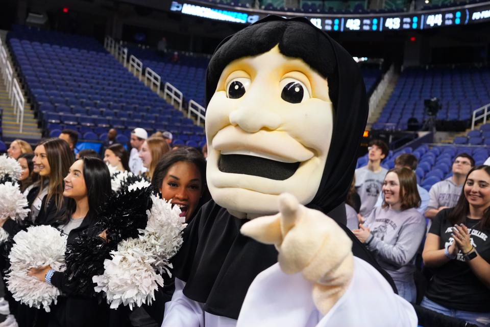 Providence Friars mascot with the cheerleaders during a practice at Greensboro Coliseum on Thursday. The No. 11 Friars meet the No. 6 Kentucky Wildcats tonight at 7:10 p.m.