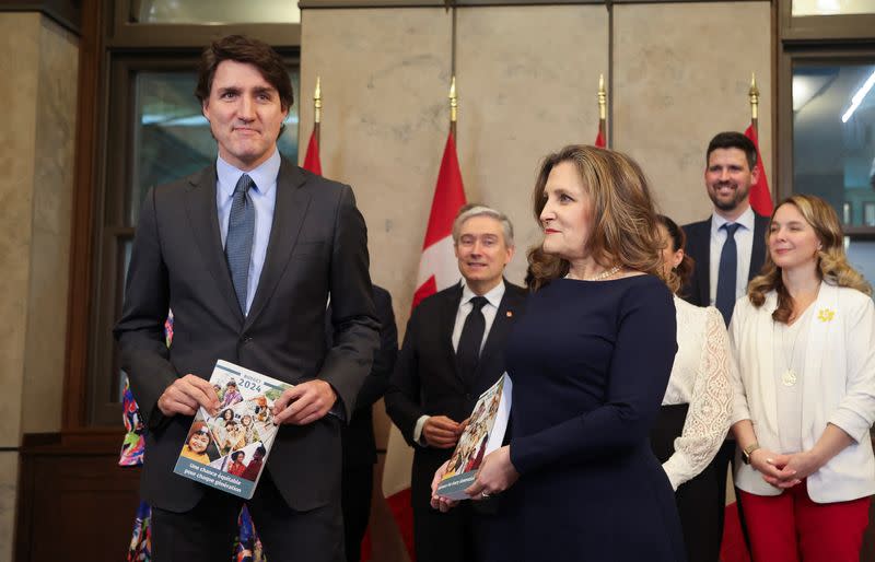 Canada's Prime Minister Justin Trudeau and Finance Minister Chrystia Freeland pose for a picture holding the 2024-25 budget in Ottawa