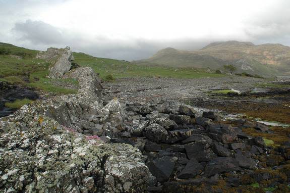 One of the thousands of cone-sheets from Ardnamurchan volcano, exposed as an inclined wall of basalt.