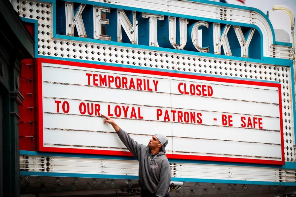 Harry Powell, of Lexington, Ky., works to change the marquee at the Kentucky Theatre in Lexington, Ky., Wednesday, March 18, 2020. The Kentucky Theatre will reopen on Jan. 28 with “Paper Moon.” First run movies will return as soon as equipment is upgraded.