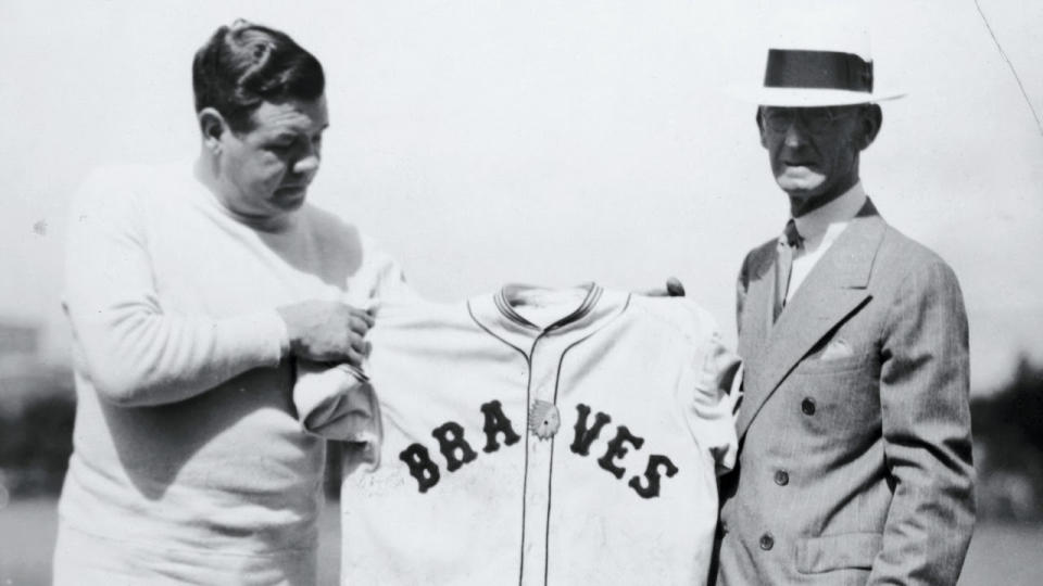 The Babe holds up his new uniform at spring training in 1935. (Keystone/FPG/Getty Images)