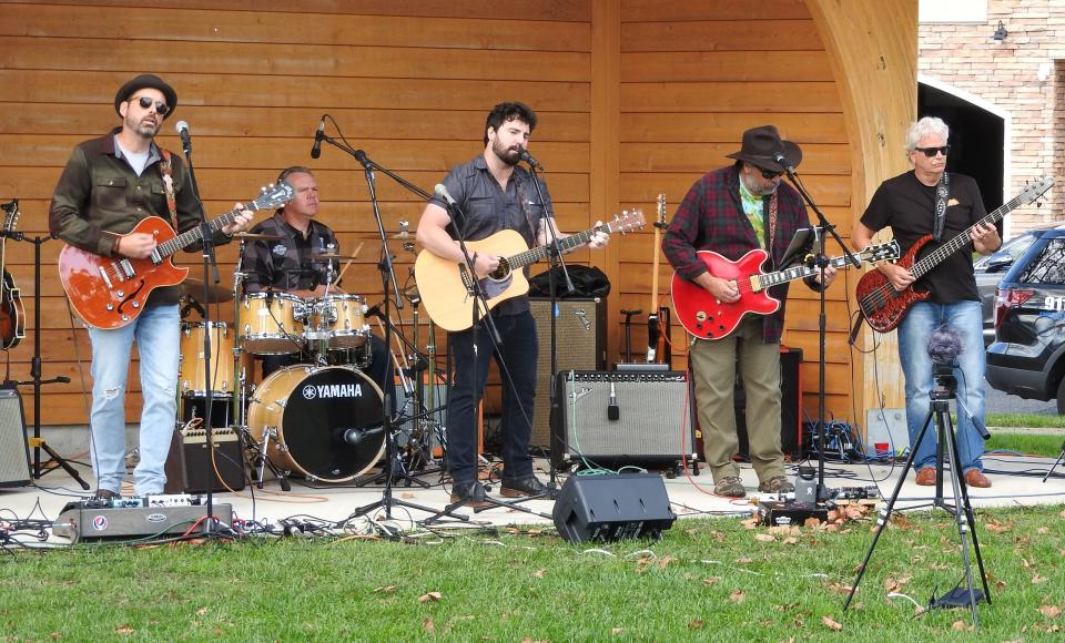 Chris Fox (center) performing with Tired Starlings at the fall 2021 edition of the Bradley Ramble at Riley Park in Bradley Beach. Also shown are David Ballard (left to right), Ed Bertini, Mike DeSantis and Paul Mann.