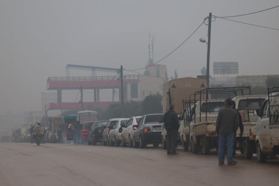 Drivers queue for petrol in December 2022 as Syria struggles under an economic crisis (AP)