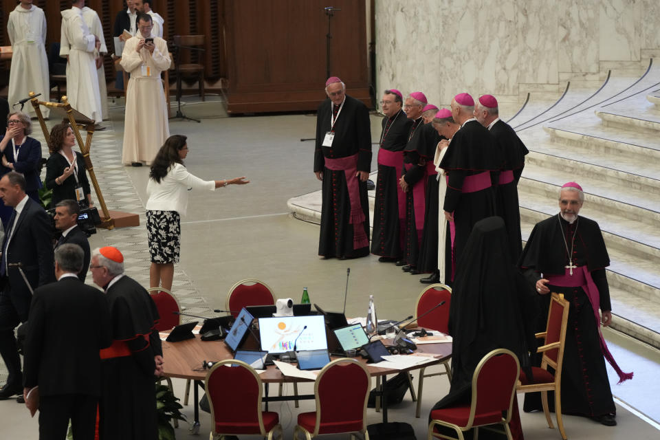 Participants in the opening session of the 16th General Assembly of the Synod of Bishops arrive in the Paul VI Hall at The Vatican, Wednesday, Oct. 4, 2023. Pope Francis is convening a global gathering of bishops and laypeople to discuss the future of the Catholic Church, including some hot-button issues that have previously been considered off the table for discussion. Key agenda items include women's role in the church, welcoming LGBTQ+ Catholics, and how bishops exercise authority. For the first time, women and laypeople can vote on specific proposals alongside bishops. (AP Photo/Gregorio Borgia)